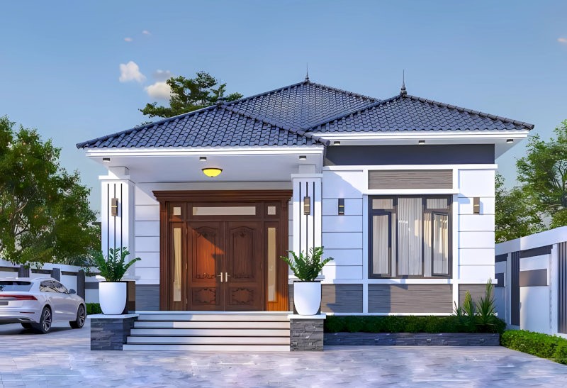 Ngôi nhà cấp 4 mái Nhật được thiết kế với mái dốc nhẹ, tông xám tro thanh lịch kết hợp tường trắng tạo vẻ hài hòa và hiện đại
