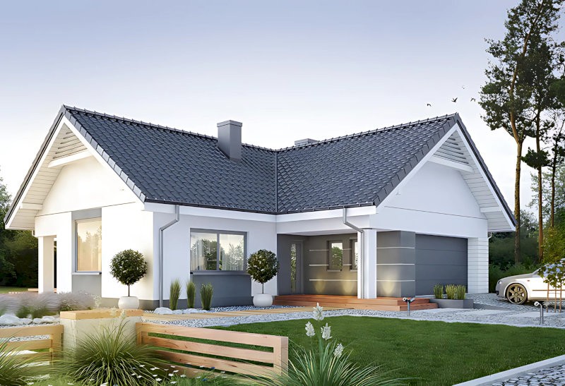 Sân trước được bố trí khu vực đỗ xe và lối đi lát đá xen cỏ, tạo không gian sống hài hòa và tiện nghi